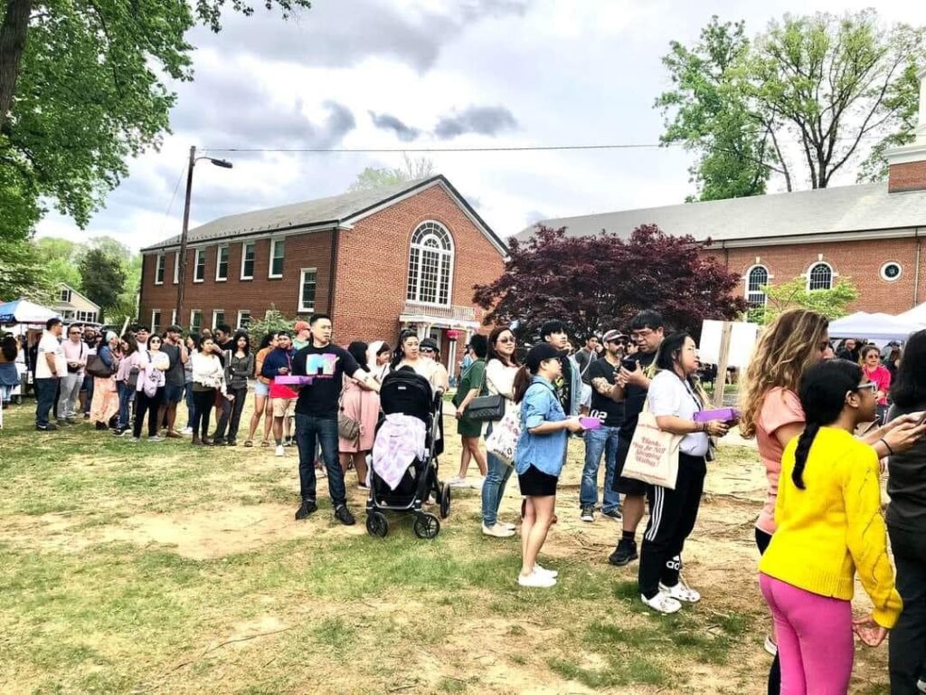 Citylight Church in the background as festival attendees gather outside during Fil-Am Spring Fest